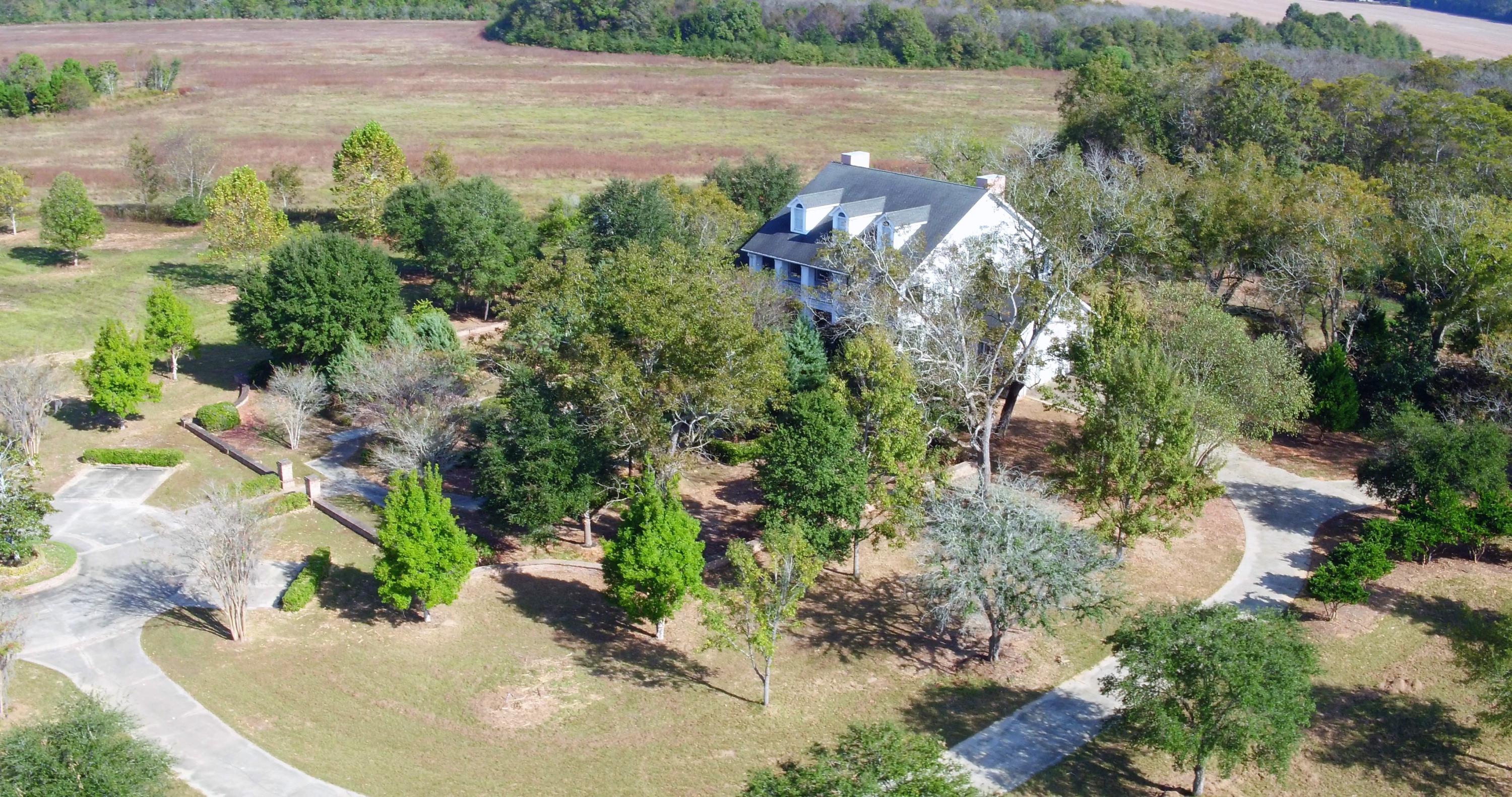 5437 Griffith Mill Road Baker, FL 32531 - Photo 61 of 100 an aerial view of a house with a yard and lake view