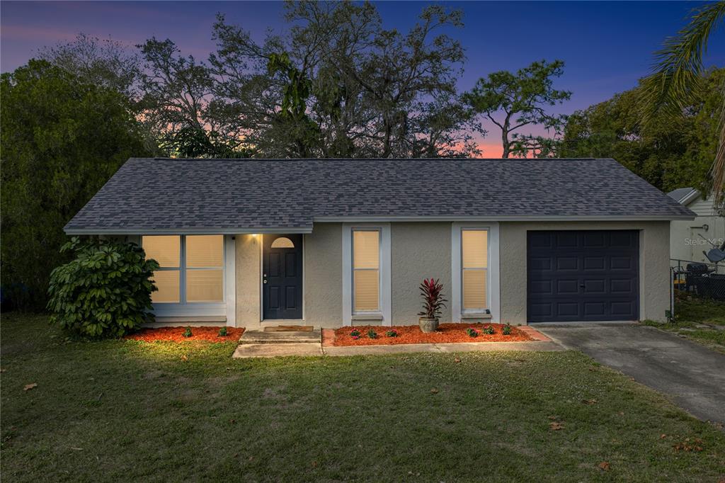 3229 Seven Springs Boulevard New Port Richey, FL 34655 - Photo 1 of 1 a front view of a house with a yard