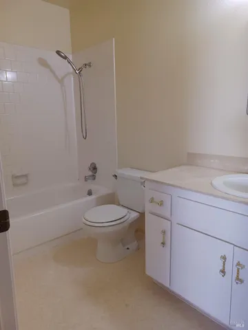 a bathroom with a toilet a sink and bathtub