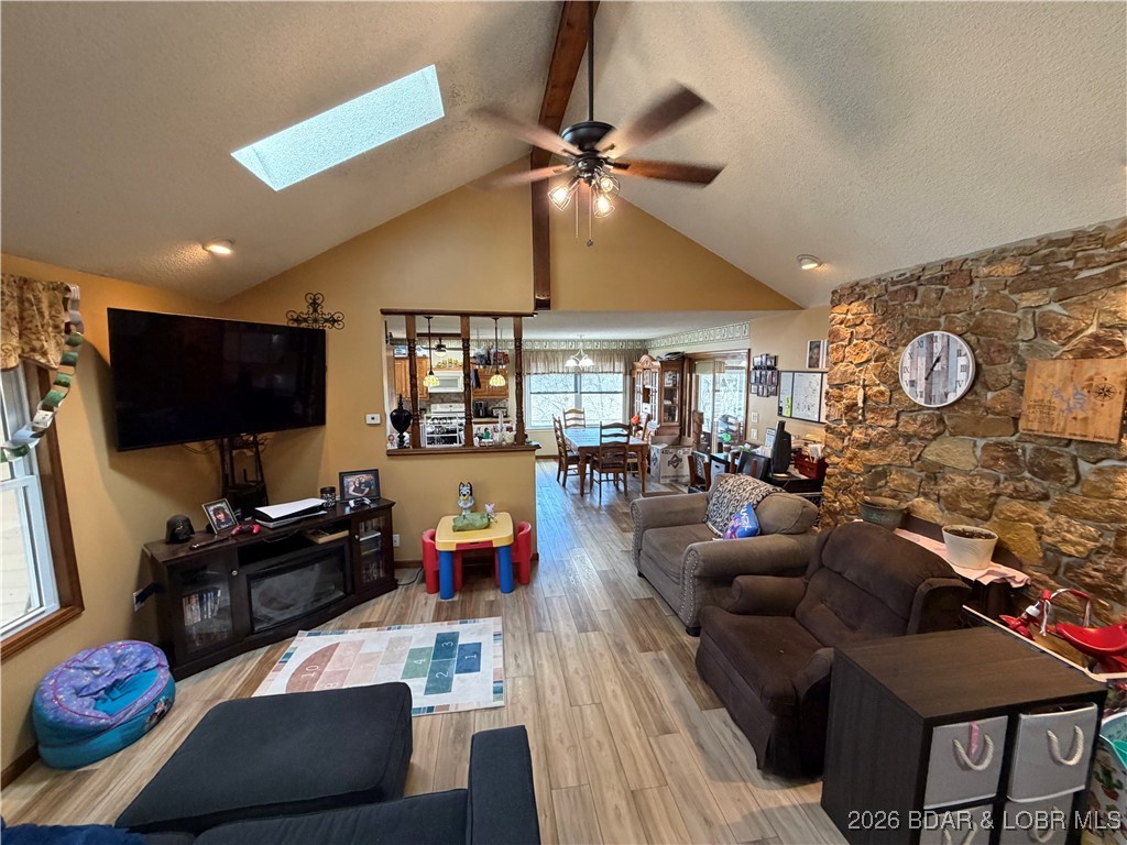 25097 Old Sante Fe Road Versailles, MO 65084 - Photo 12 of 23 Living room with vaulted ceilings