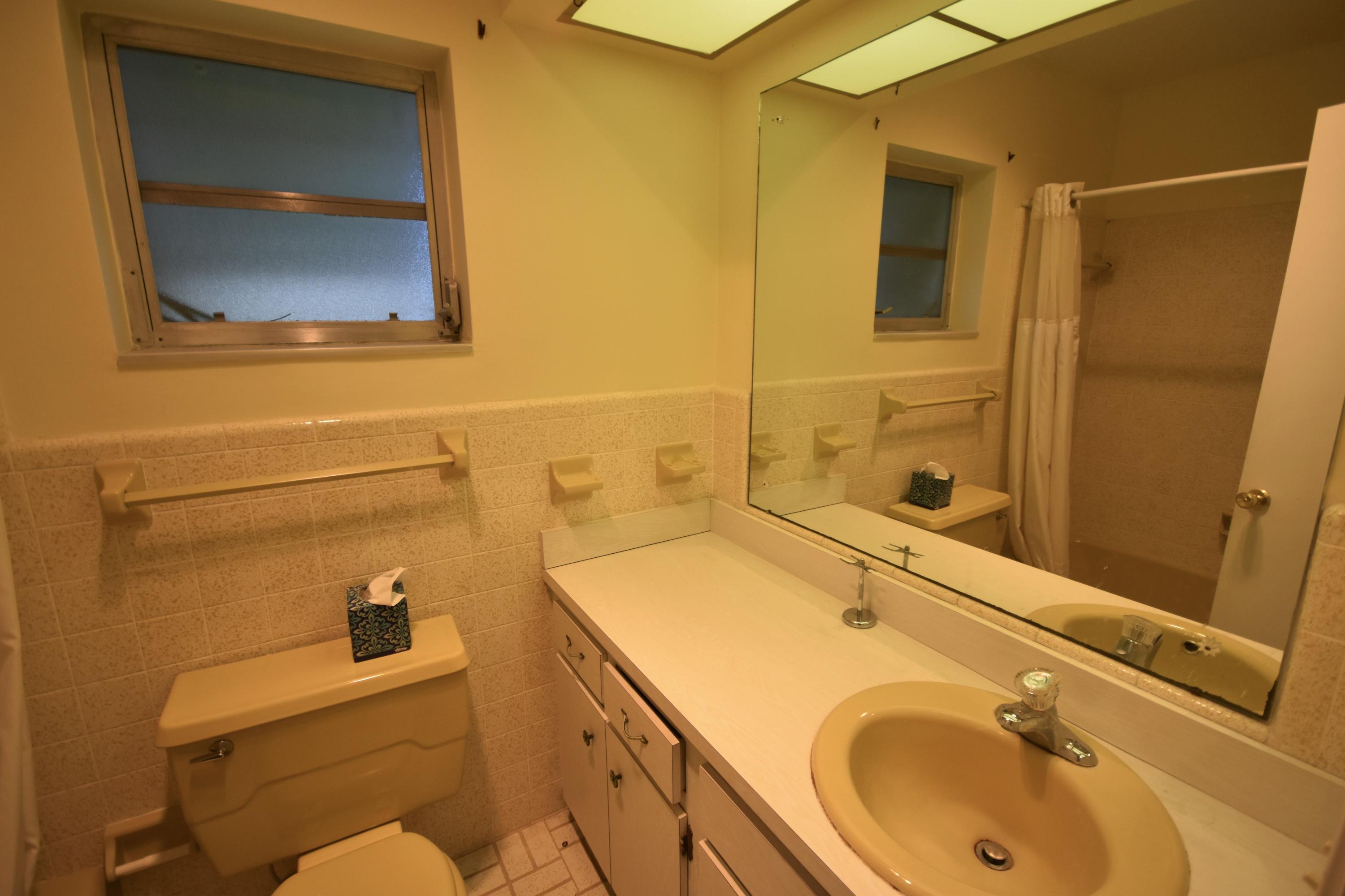 500 Northwest 12th Avenue Boca Raton, FL 33486 - Photo 13 of 23 a bathroom with a sink and a tub