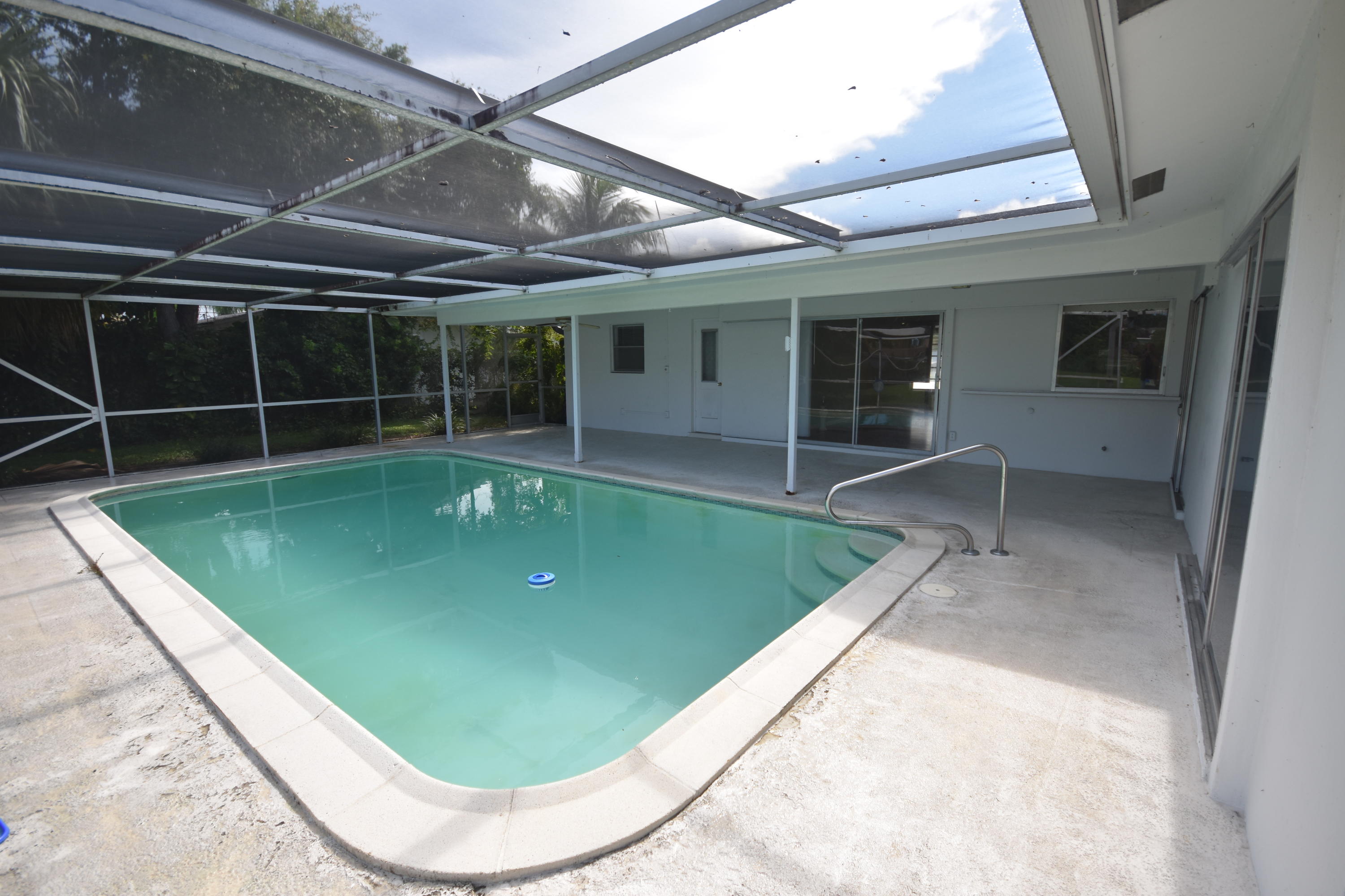 500 Northwest 12th Avenue Boca Raton, FL 33486 - Photo 2 of 23 a view of a backyard with table and chairs