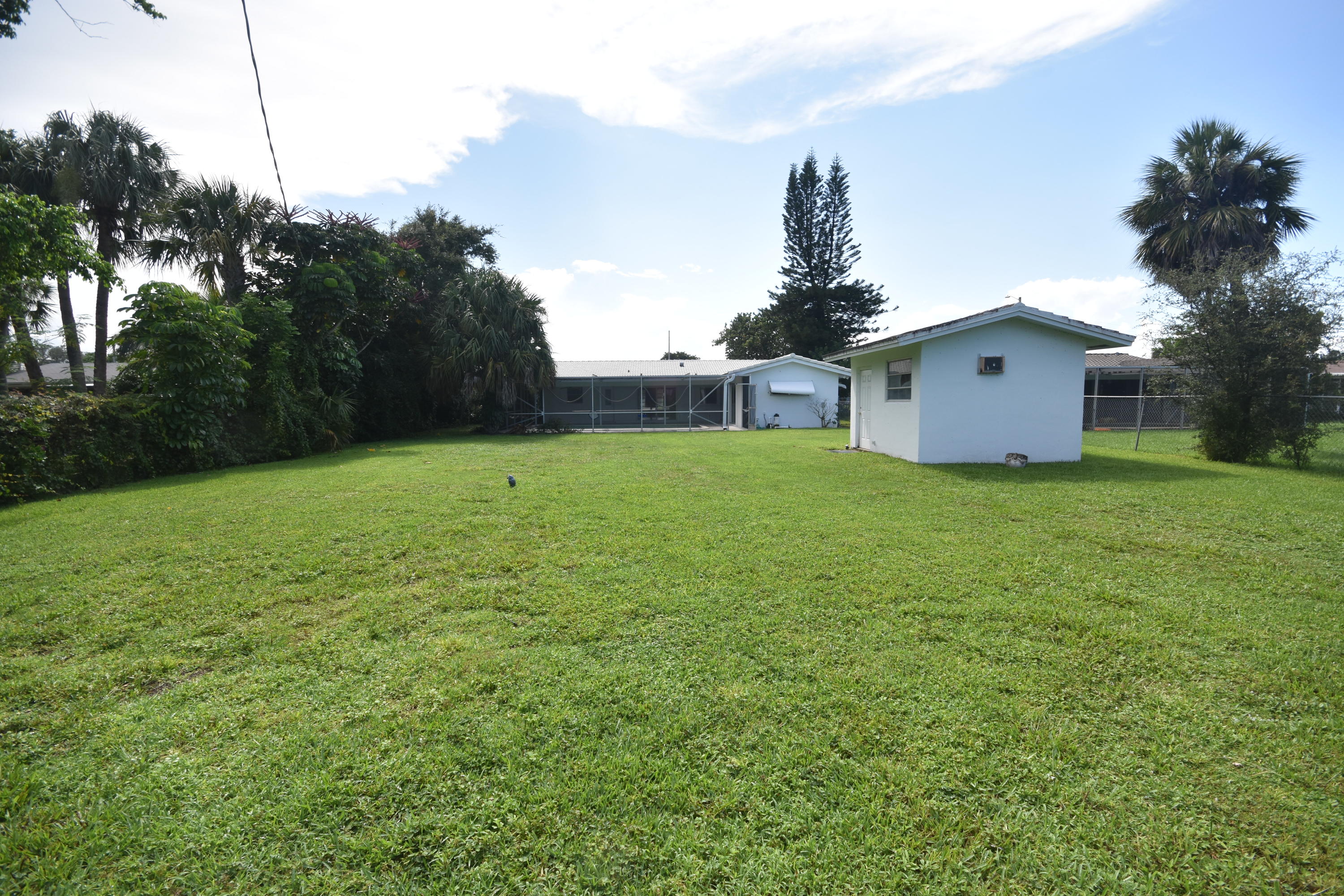 500 Northwest 12th Avenue Boca Raton, FL 33486 - Photo 22 of 23 a house with a garden