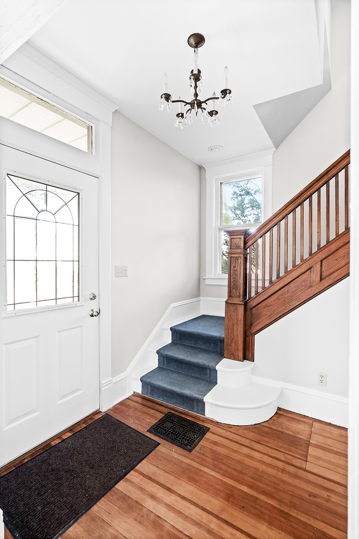 102 Vale Street Bloomington, IL 61701 - Photo 17 of 35 a view of entryway and hall with wooden floor