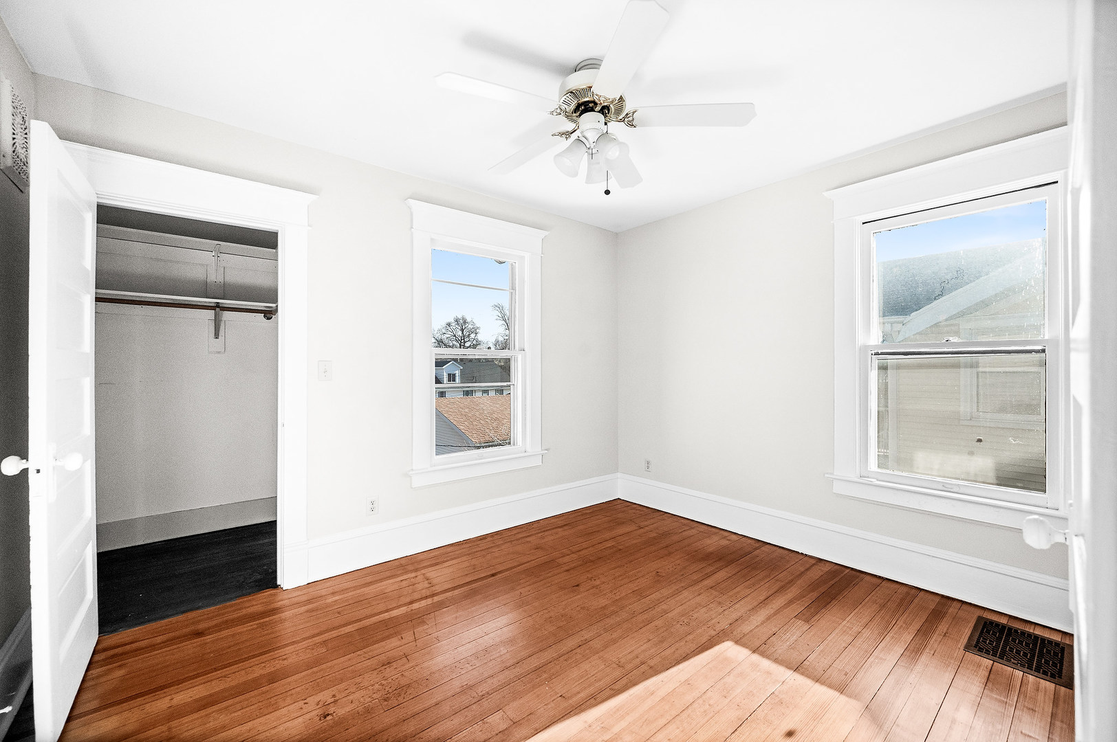 102 Vale Street Bloomington, IL 61701 - Photo 23 of 35 a view of an empty room with wooden floor and a window