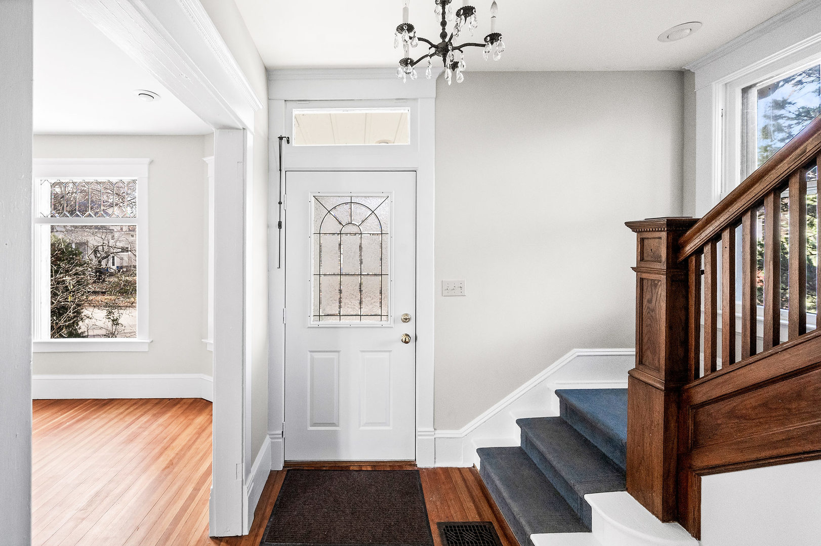 102 Vale Street Bloomington, IL 61701 - Photo 5 of 35 a view of a hallway with wooden floor and staircase