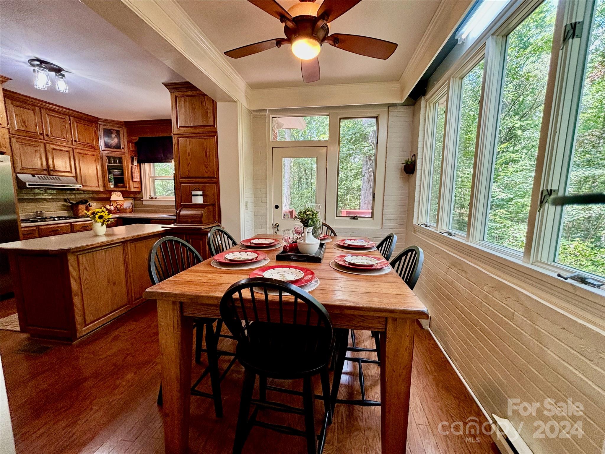 352 Chimney Rock Road Rutherfordton, NC 28139 - Photo 12 of 48 a view of a dining room with furniture window and wooden floor