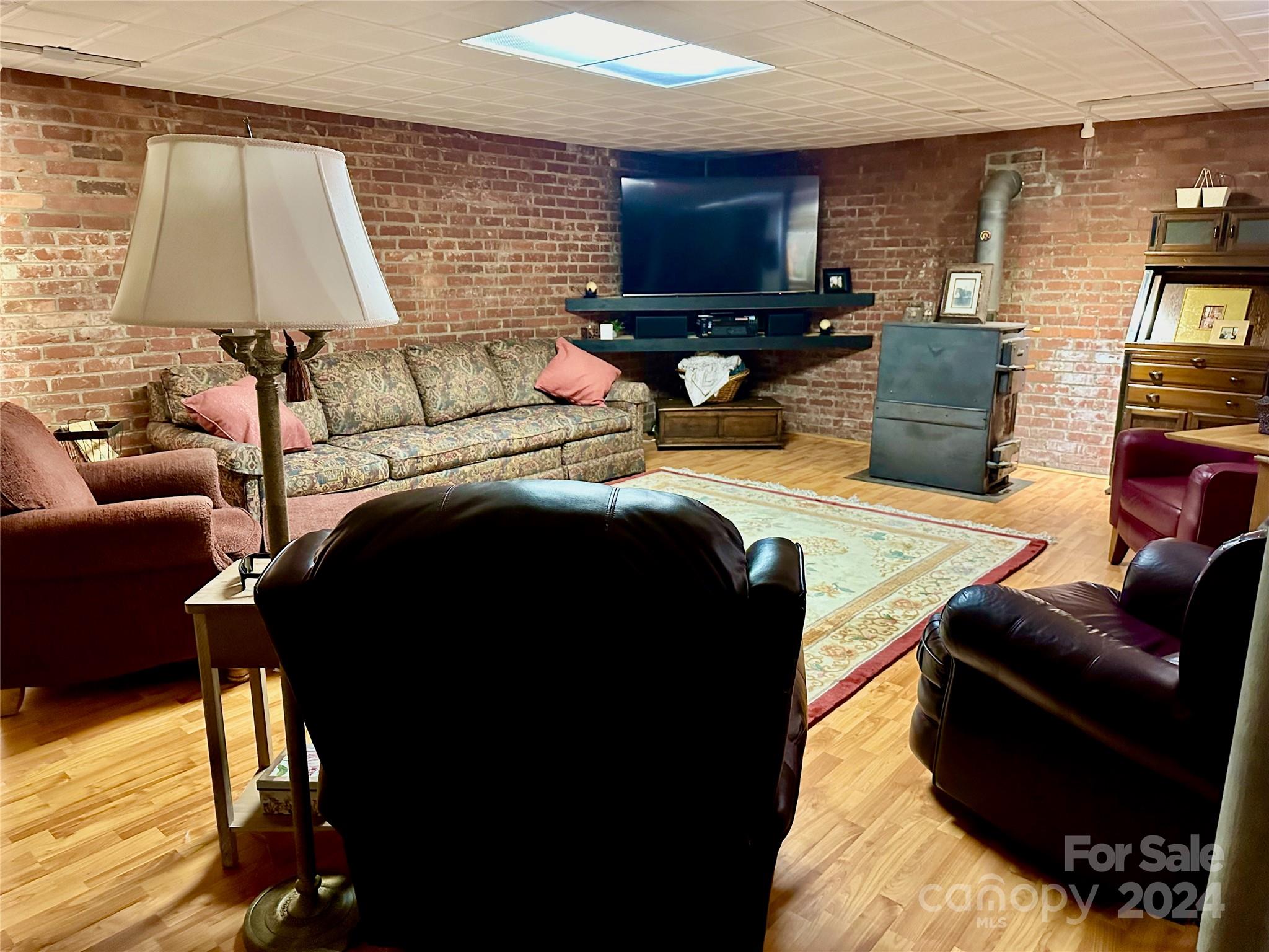 352 Chimney Rock Road Rutherfordton, NC 28139 - Photo 29 of 48 a living room with furniture and a flat screen tv