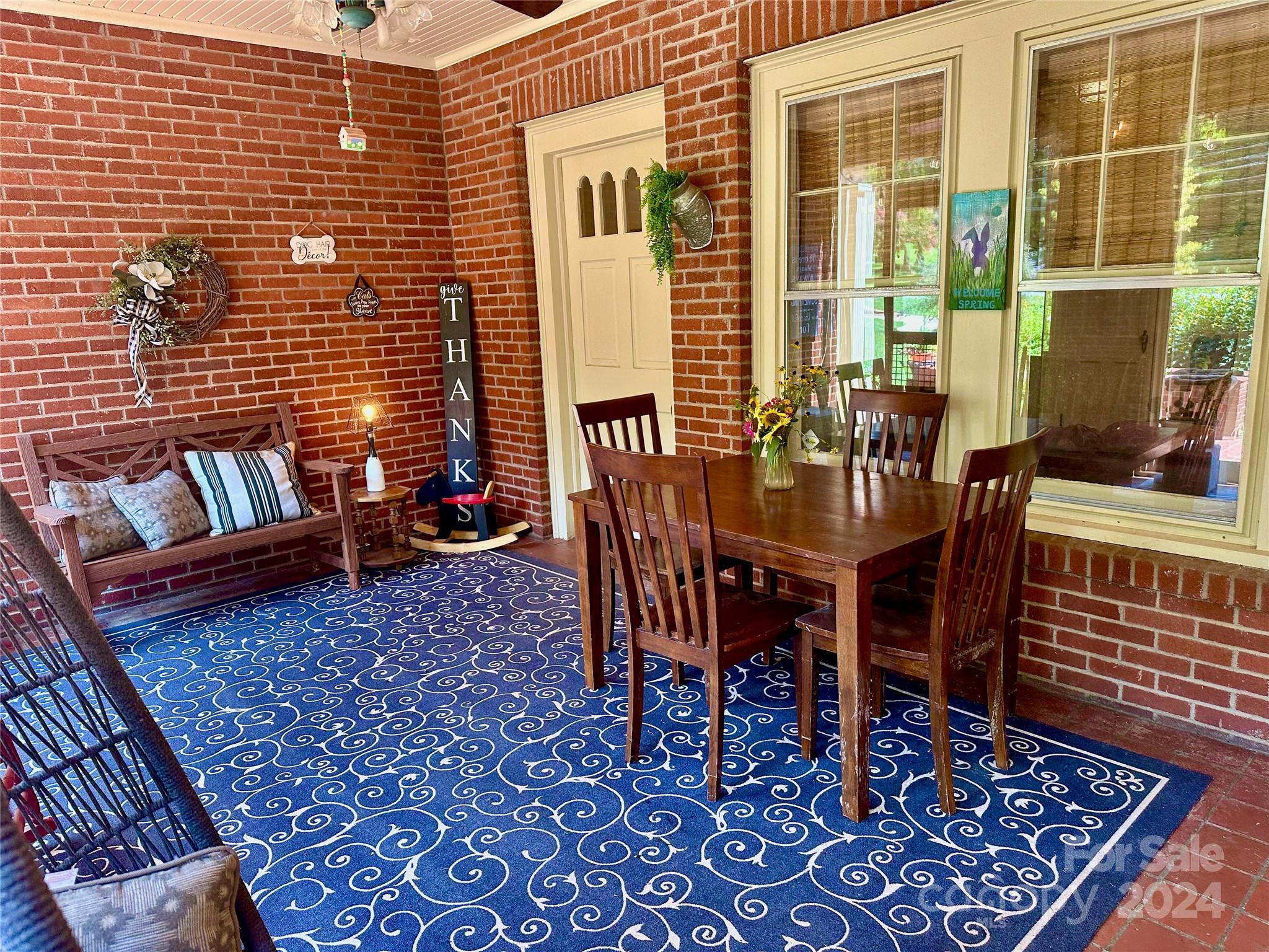 352 Chimney Rock Road Rutherfordton, NC 28139 - Photo 4 of 48 a view of a dinning table and chair in the patio