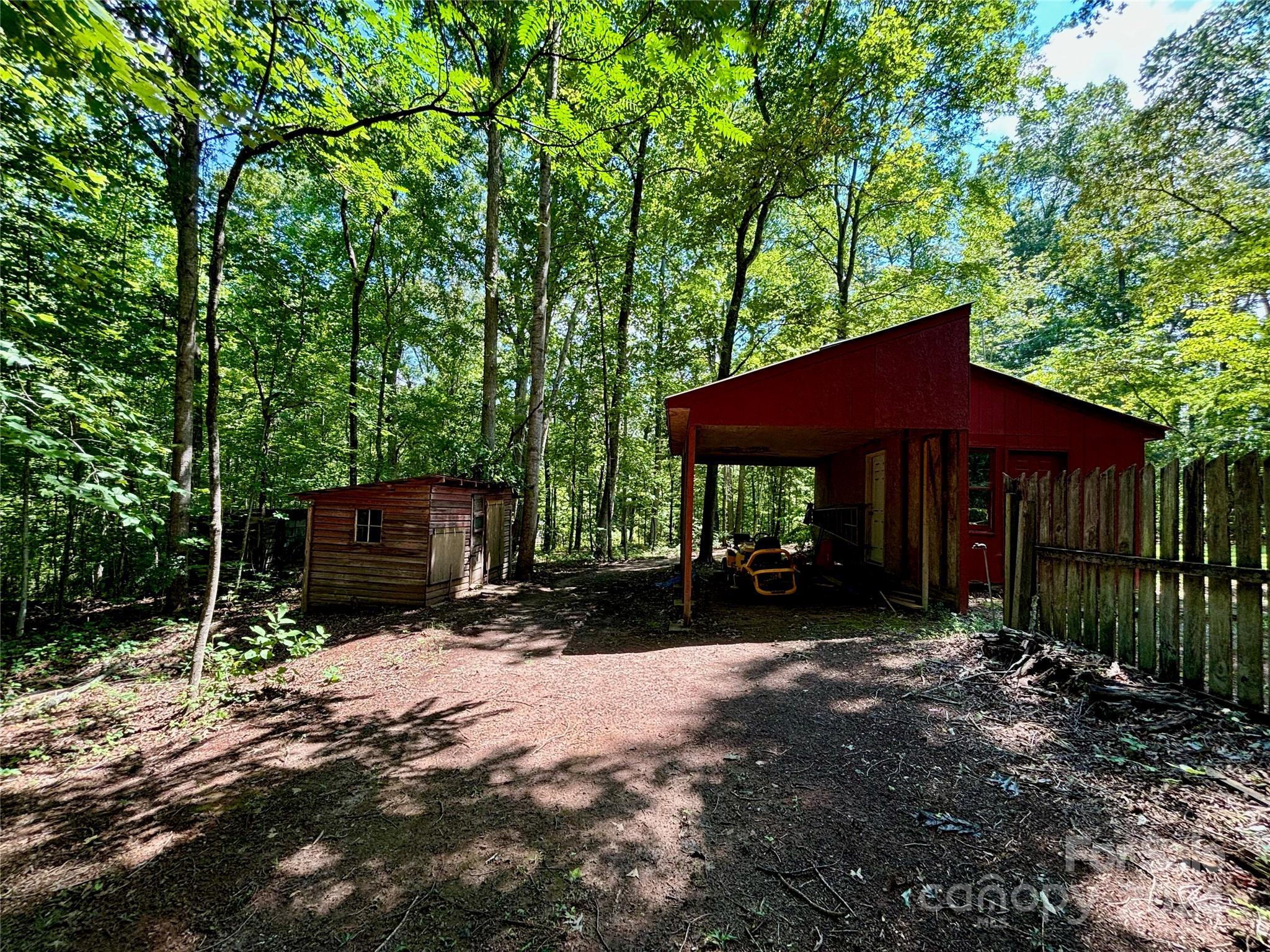 352 Chimney Rock Road Rutherfordton, NC 28139 - Photo 47 of 48 a view of backyard with wooden fence and a large tree