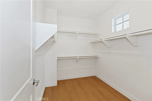 a bathroom with double sink and a mirror