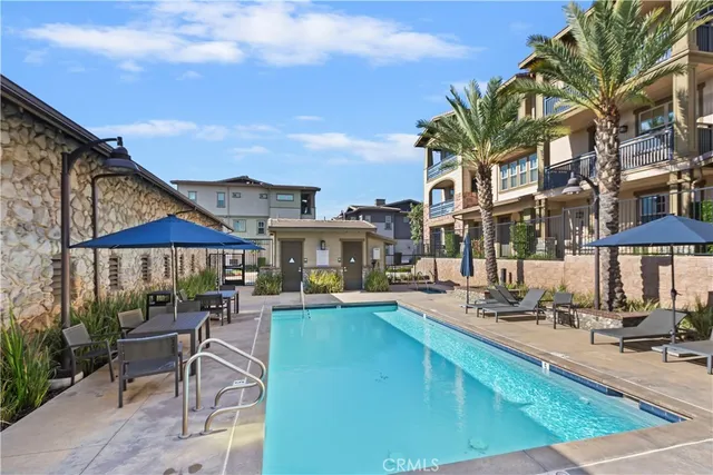 a view of a patio with swimming pool table and chairs