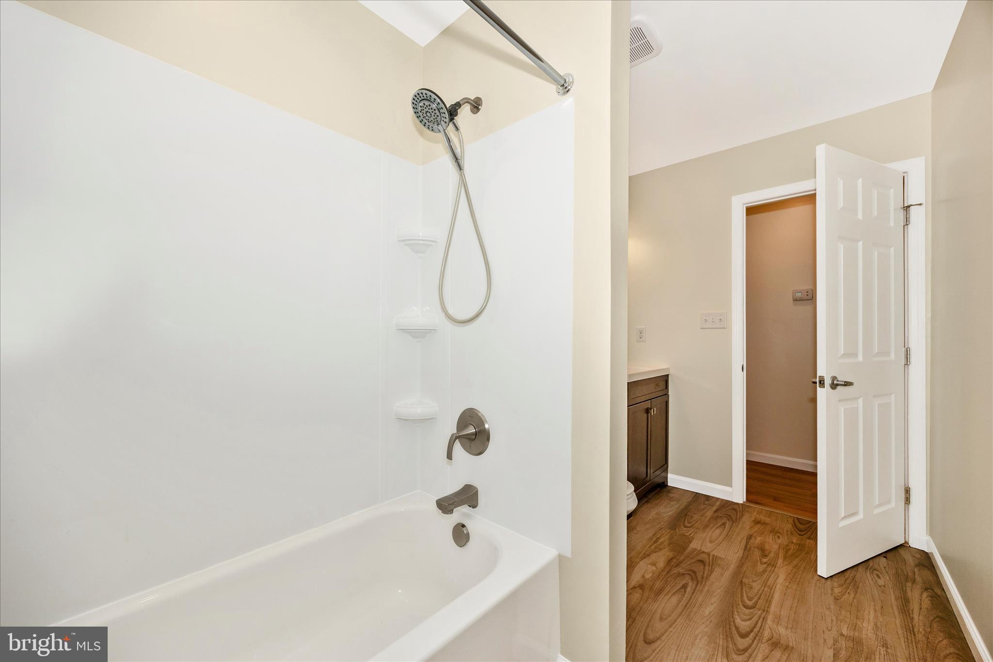 6518 Woodville Road Mount Airy, MD 21771 - Photo 33 of 53 a bathroom with a bath tub and shower