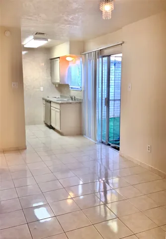 a view of a kitchen with furniture and staircase