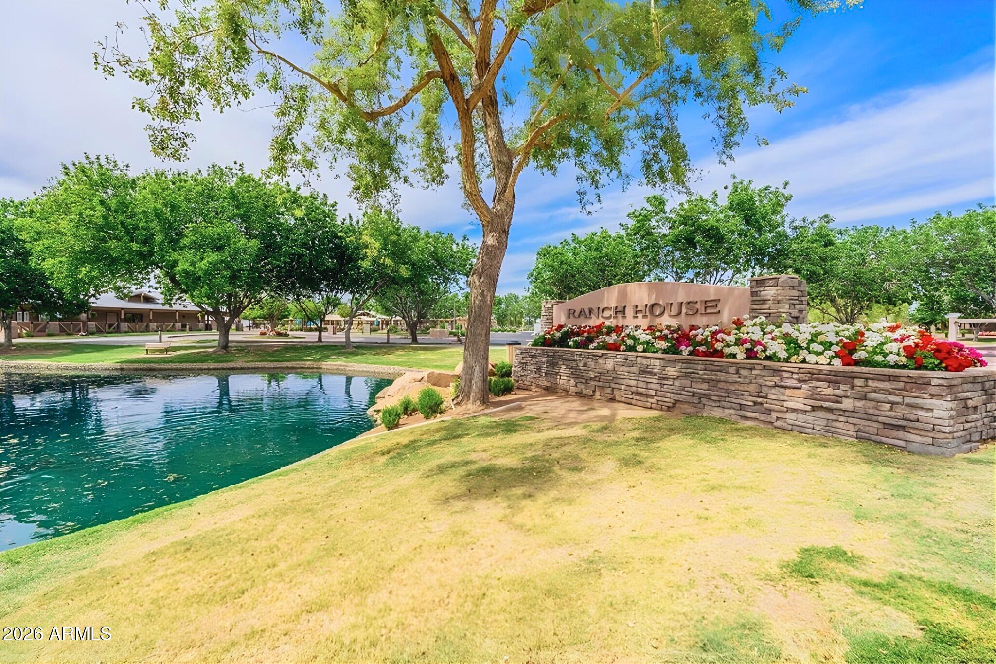 3936 East Blue Sage Road Gilbert, AZ 85297 - Photo 25 of 27 a view of a swimming pool with an outdoor space and seating area