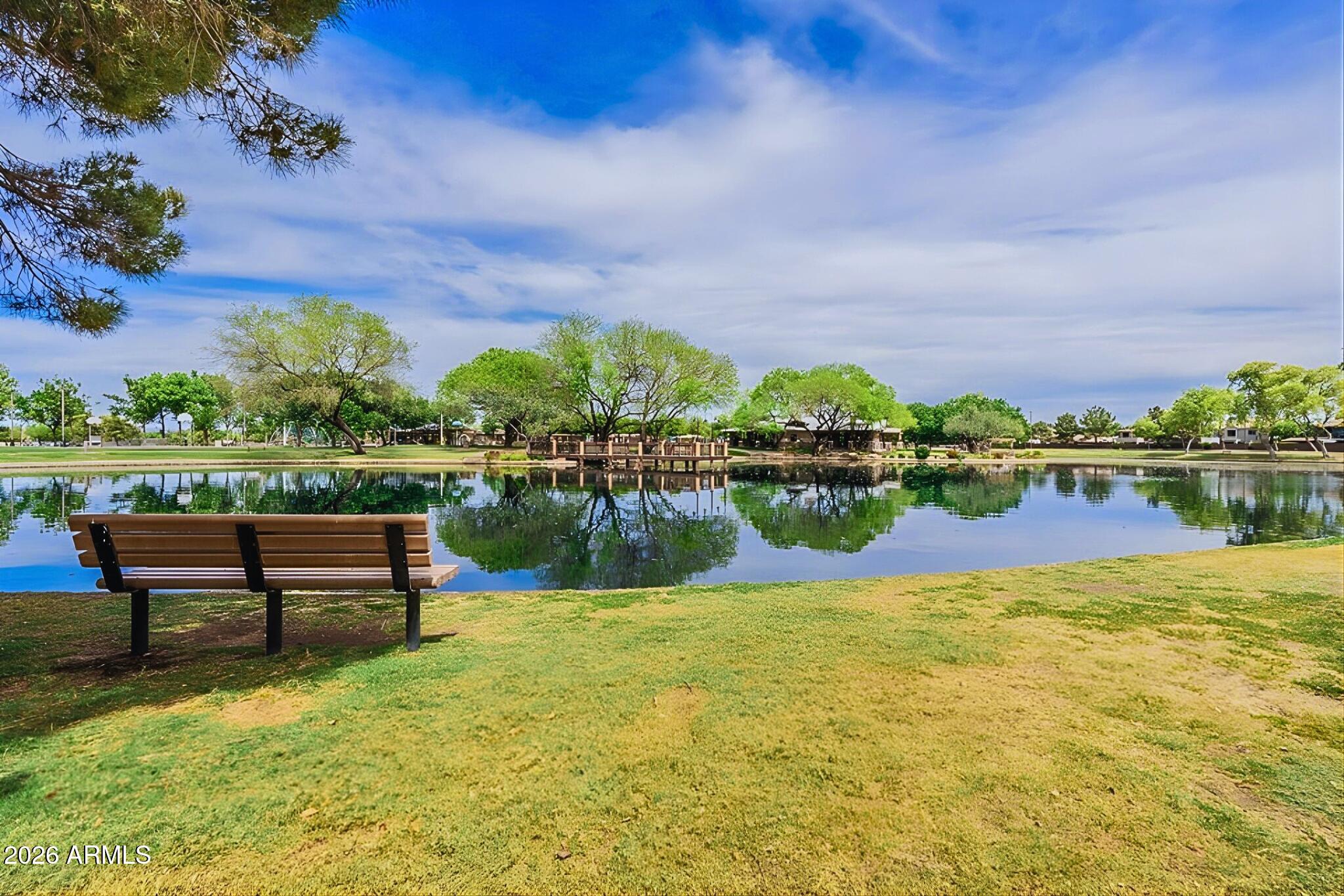3936 East Blue Sage Road Gilbert, AZ 85297 - Photo 26 of 27 a view of a lake with a garden