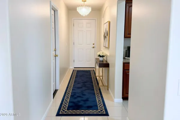 a view of an house with entertaining space and a road