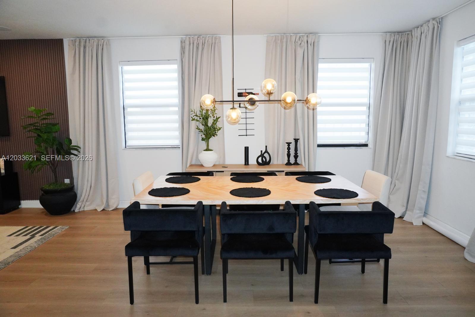11942 Southwest 243rd Street Homestead, FL 33032 - Photo 7 of 50 a view of a dining room with furniture and window