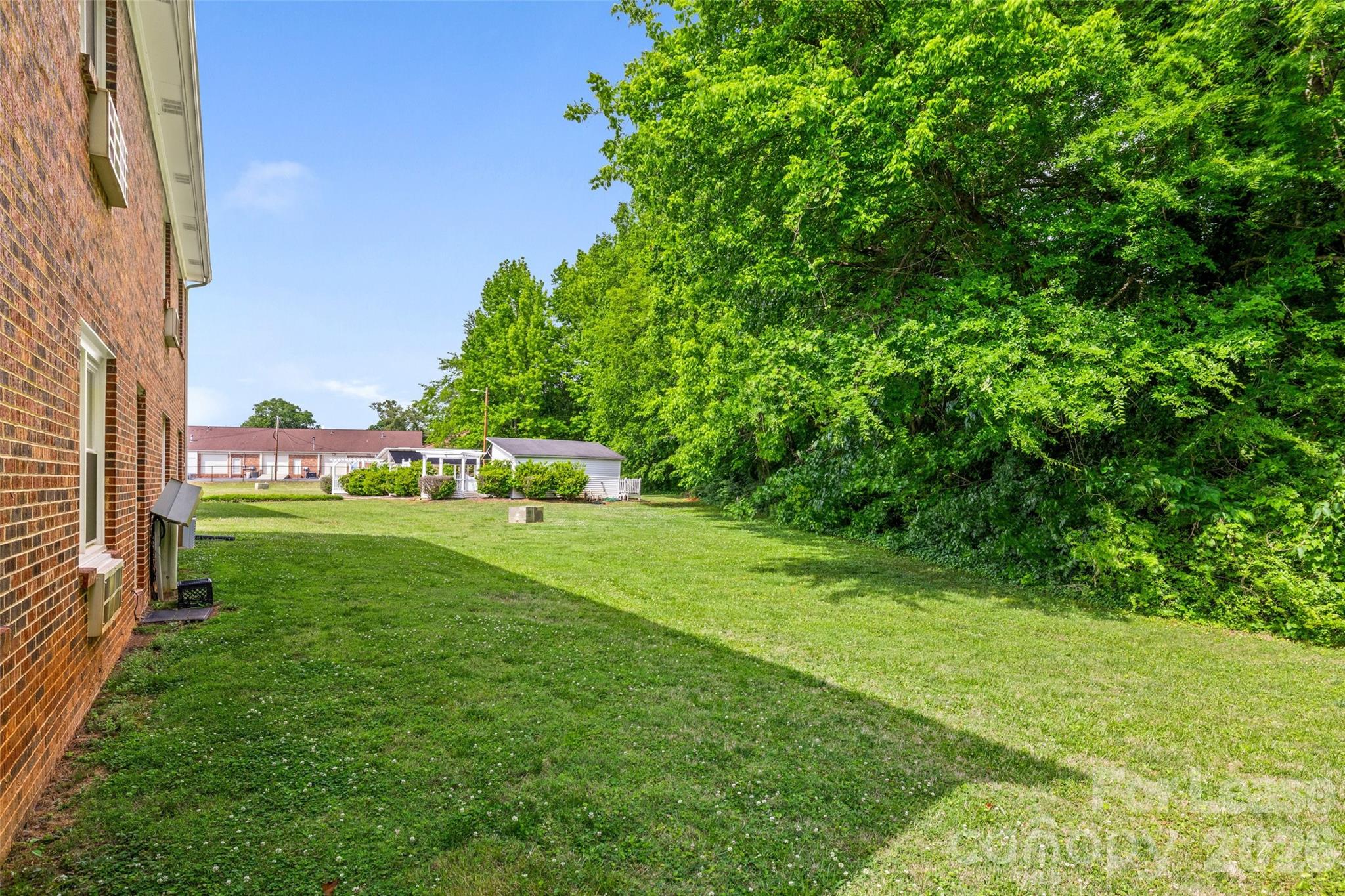 113 Stroupe Road, Unit E Gastonia, NC 28056 - Photo 26 of 33 a view of green field with sitting area
