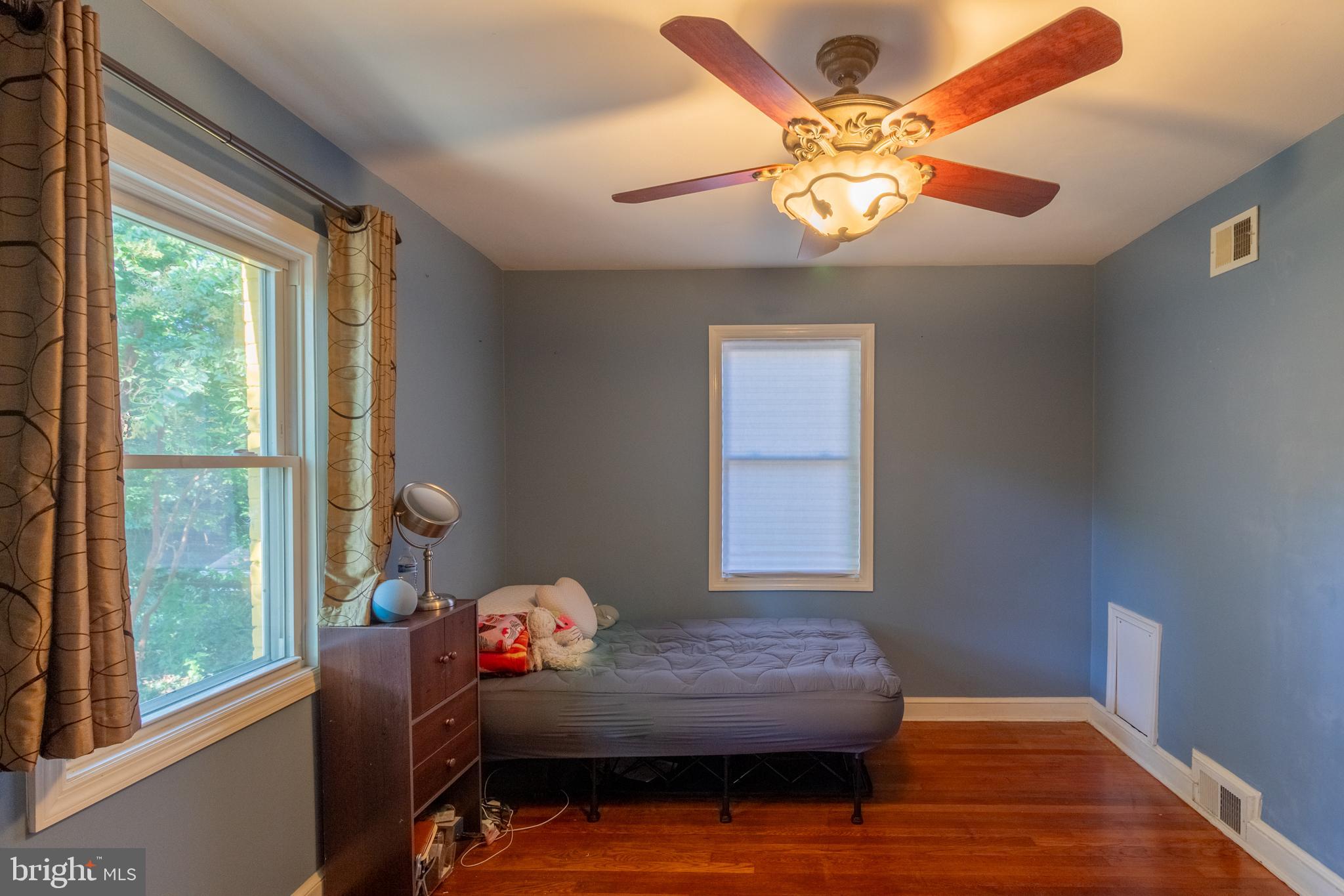 706 Forest Glen Road Silver Spring, MD 20901 - Photo 17 of 40 a bedroom with furniture and a window