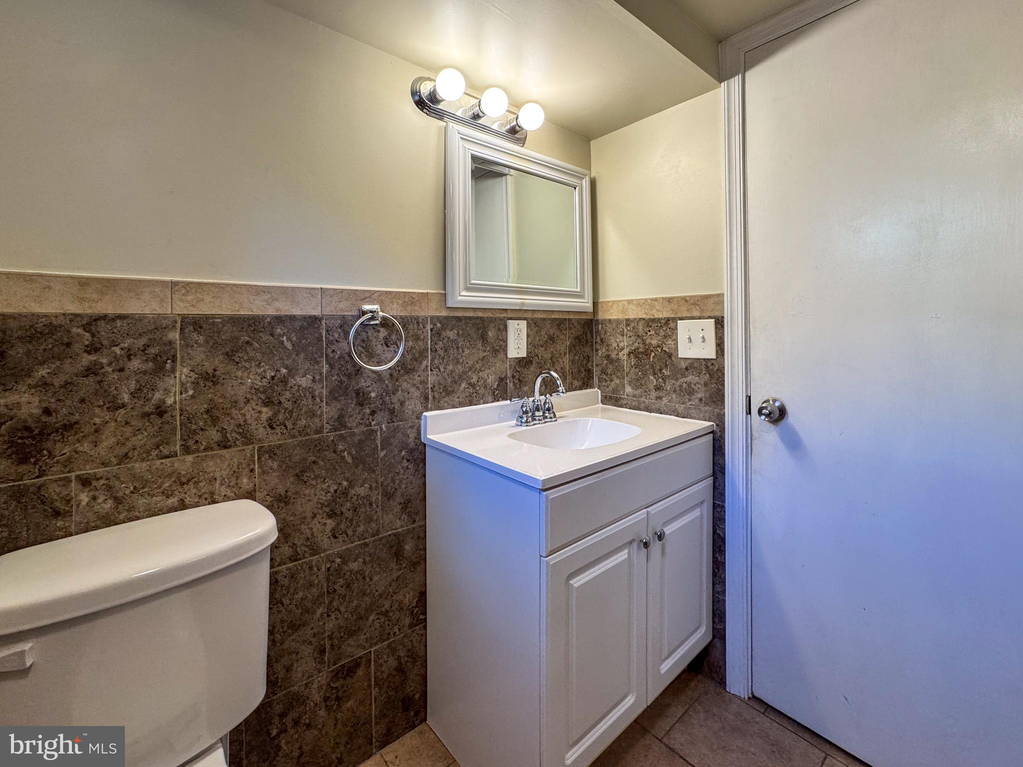 706 Forest Glen Road Silver Spring, MD 20901 - Photo 30 of 40 a bathroom with a sink and a toilet