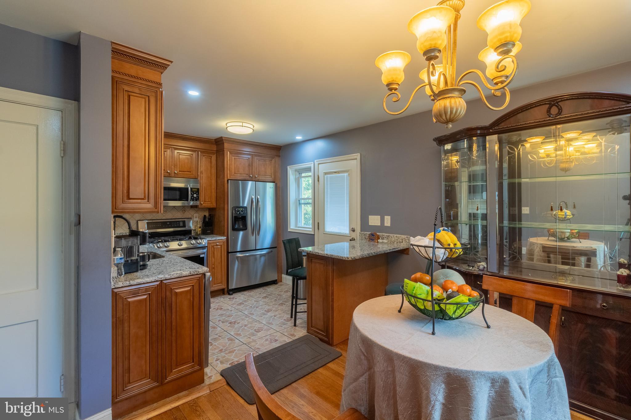 706 Forest Glen Road Silver Spring, MD 20901 - Photo 3 of 40 a kitchen with a table and chairs