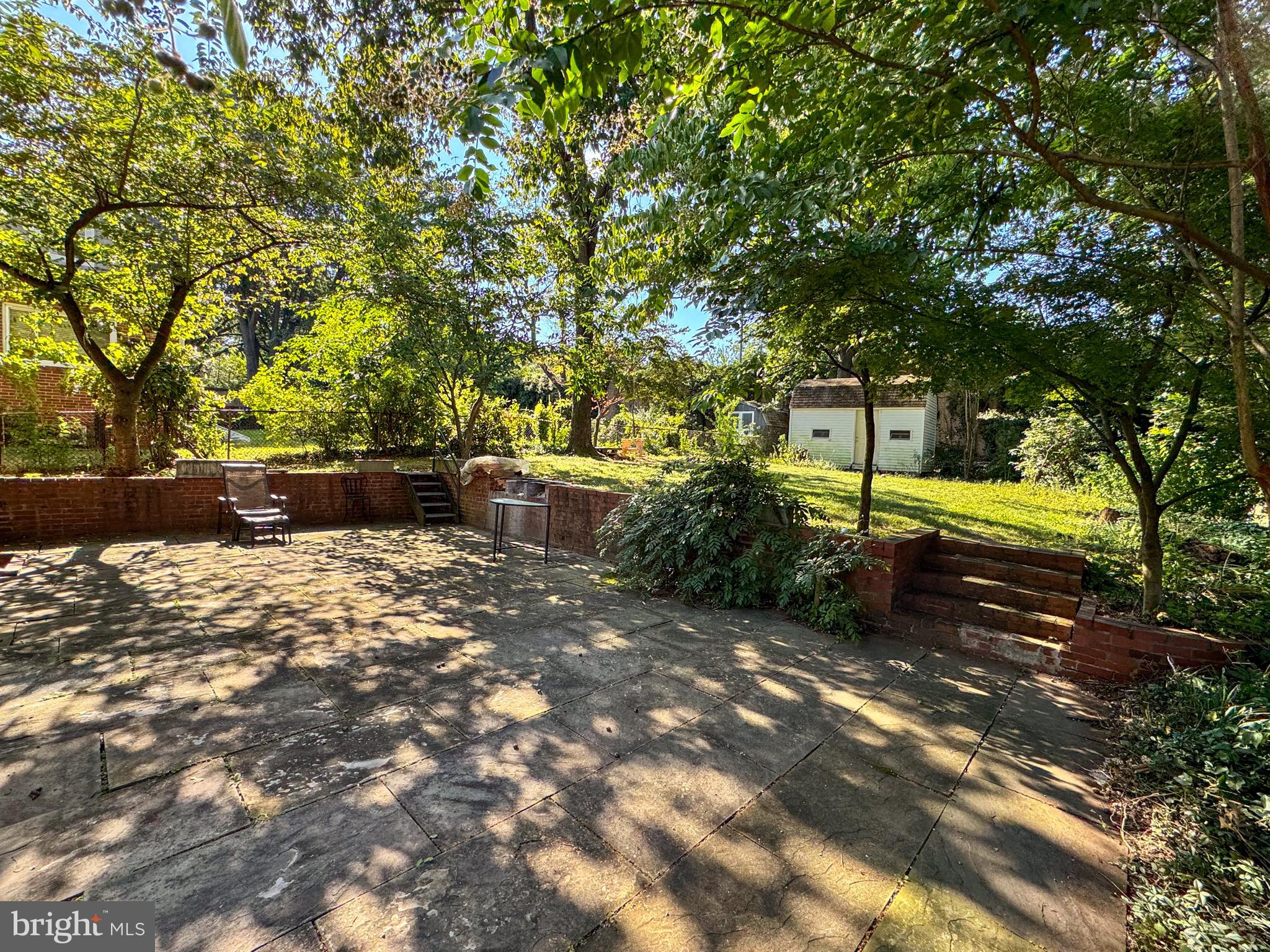 706 Forest Glen Road Silver Spring, MD 20901 - Photo 36 of 40 a backyard of a house with a table and chairs