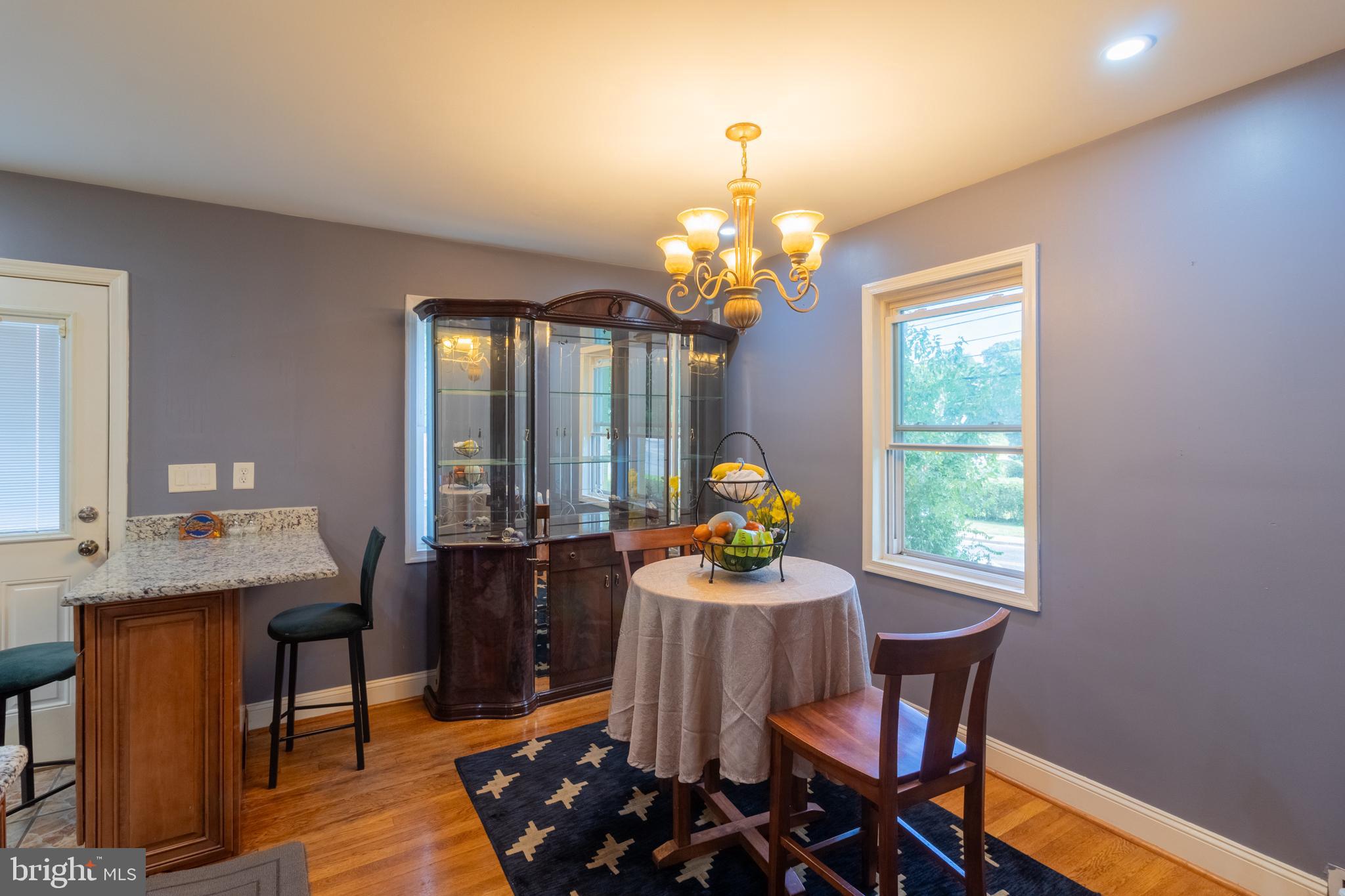 706 Forest Glen Road Silver Spring, MD 20901 - Photo 5 of 40 a view of a dining room with furniture and chandelier