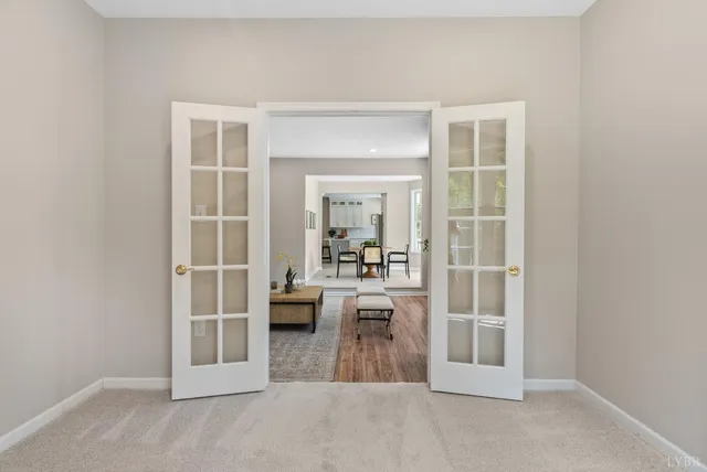 a view of a big room with a ceiling fan