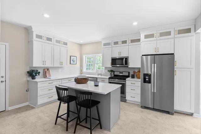 a spacious bathroom with a sink a mirror and a bathtub