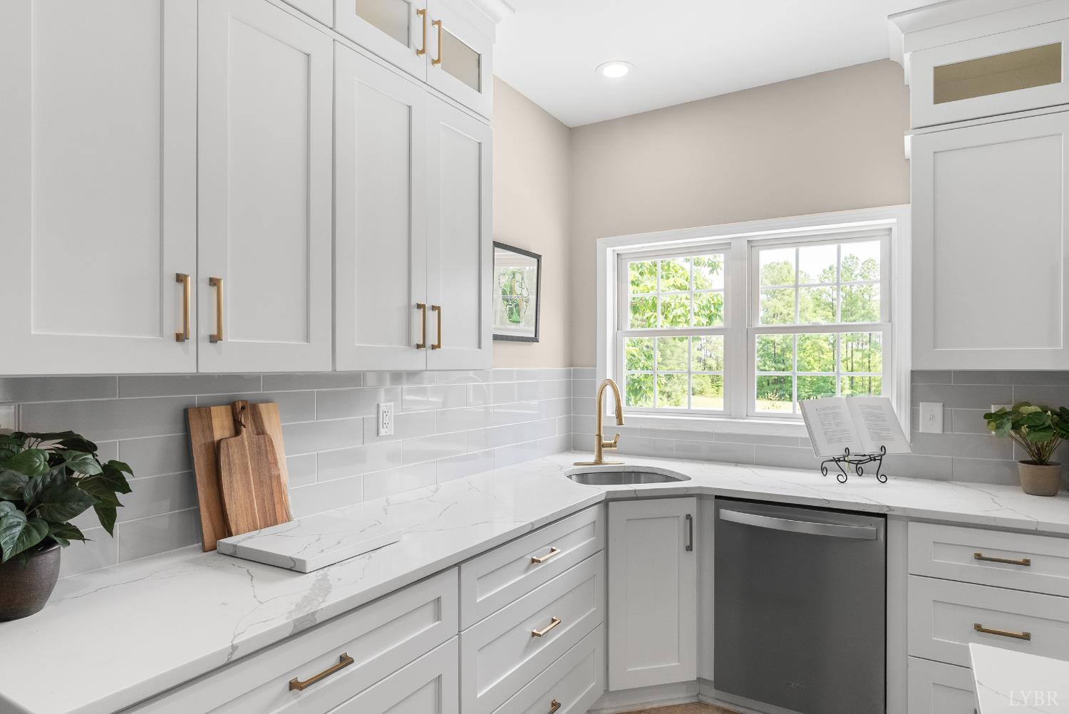 1505 Chestnut Grv Road Appomattox, VA 24522 - Photo 30 of 99 a kitchen with white cabinets and a window