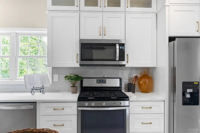a living room with a washing machine and a fireplace