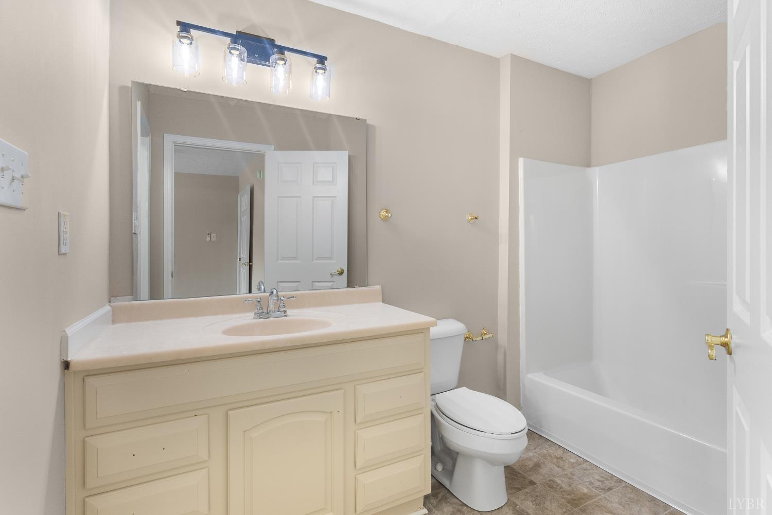 1505 Chestnut Grv Road Appomattox, VA 24522 - Photo 41 of 99 a bathroom with a sink toilet vanity and shower