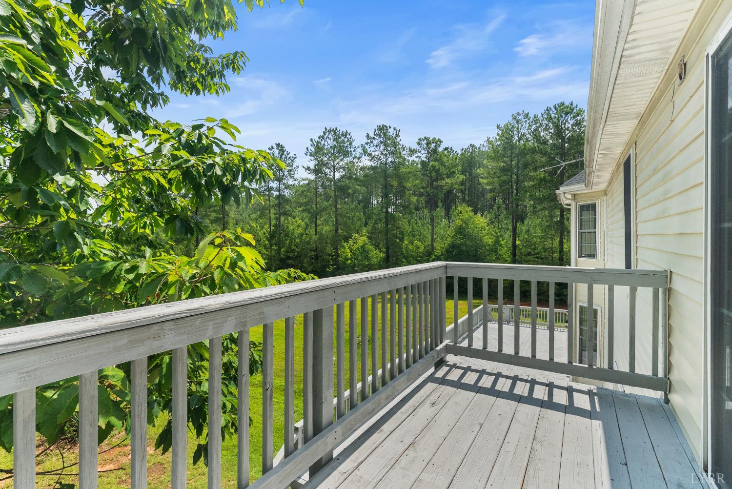 1505 Chestnut Grv Road Appomattox, VA 24522 - Photo 46 of 99 a balcony with wooden floor and outdoor space