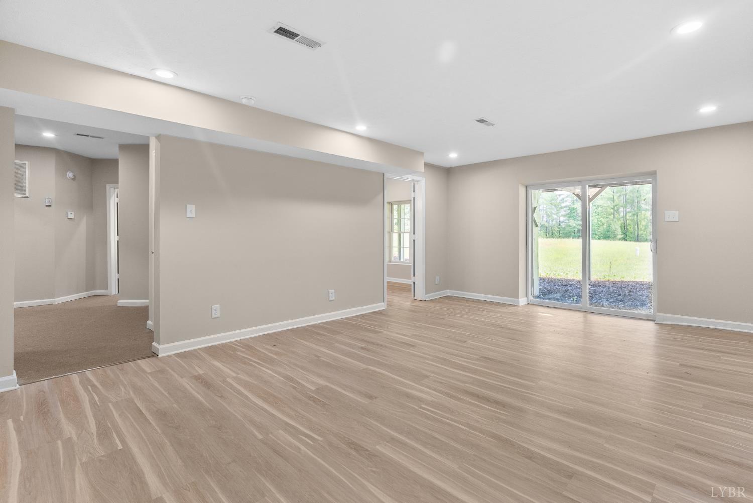 1505 Chestnut Grv Road Appomattox, VA 24522 - Photo 74 of 99 a view of an empty room with wooden floor and a window