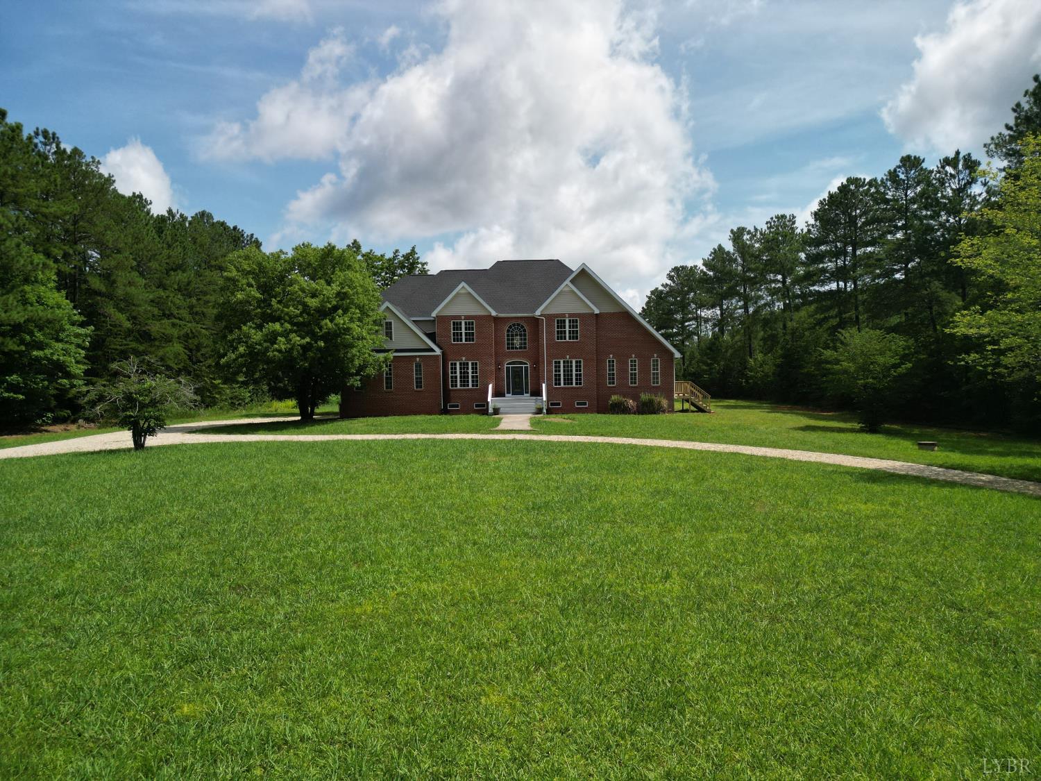 1505 Chestnut Grv Road Appomattox, VA 24522 - Photo 77 of 99 a view of a green field with house in the background