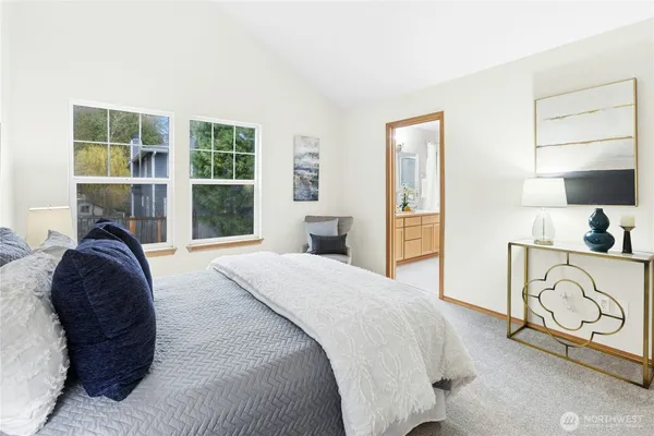 a bedroom with a bed window and wall painting