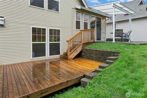 a view of a house with backyard and porch