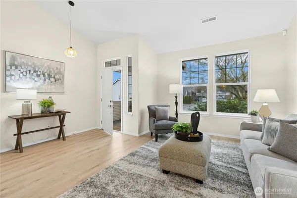 a living room with furniture and a window