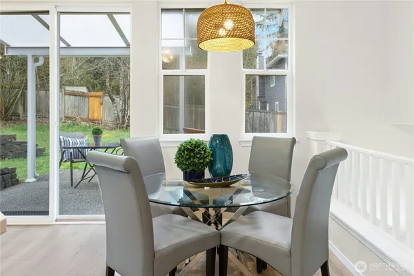 a view of a dining room with furniture window and outside view