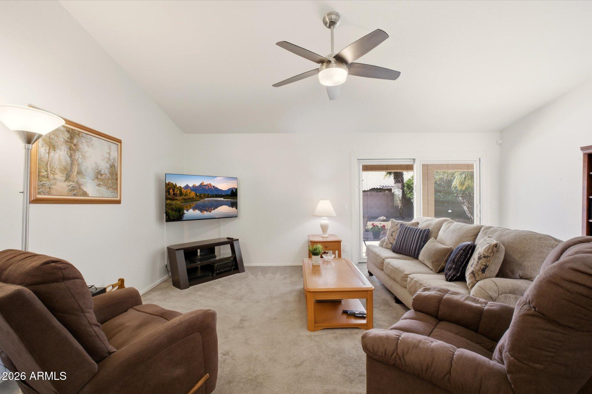 9327 West Mountain View Road Peoria, AZ 85345 - Photo 11 of 30 a living room with furniture a rug and a window
