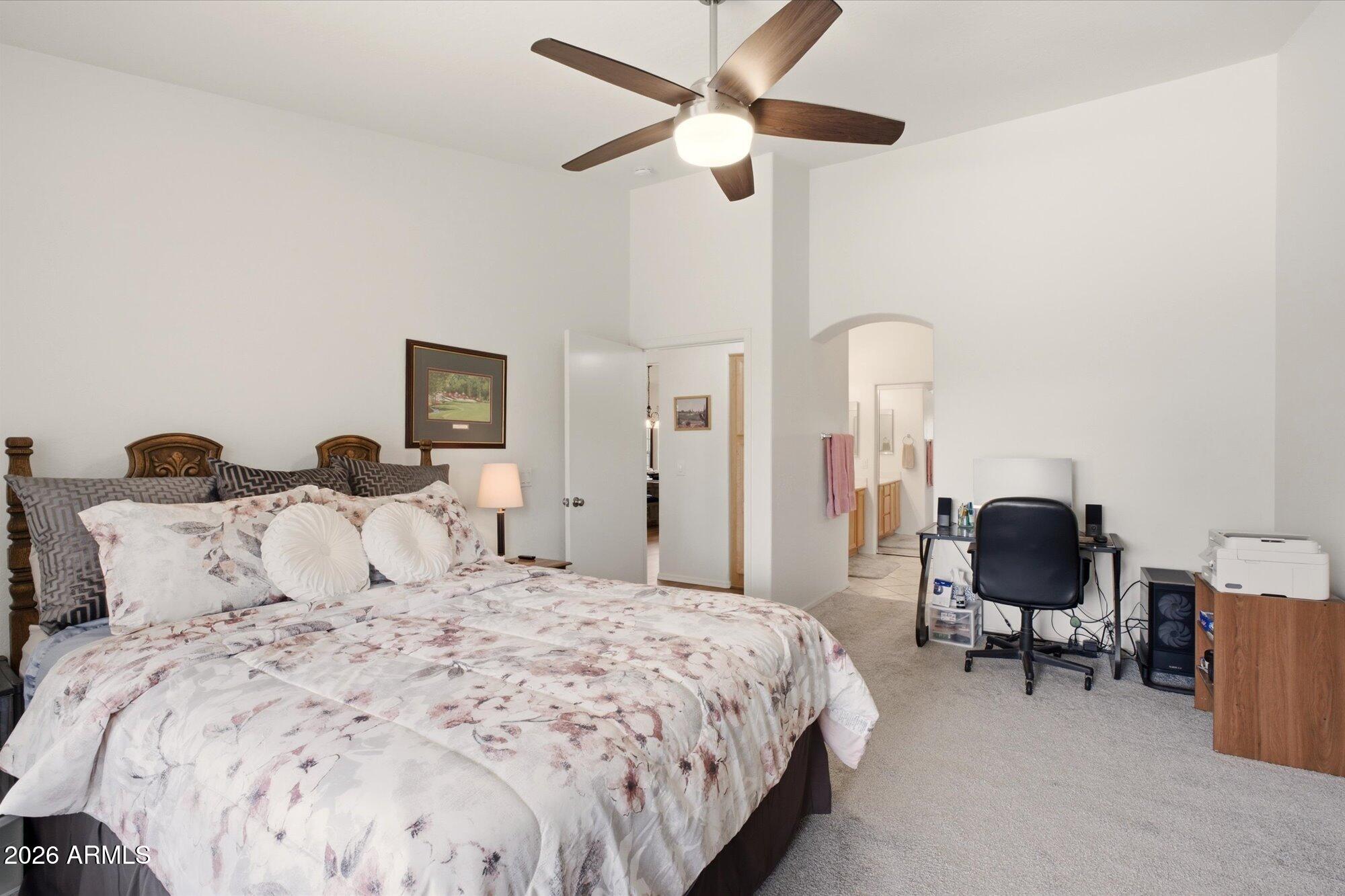 9327 West Mountain View Road Peoria, AZ 85345 - Photo 16 of 30 a bedroom with a bed gym equipment and a window