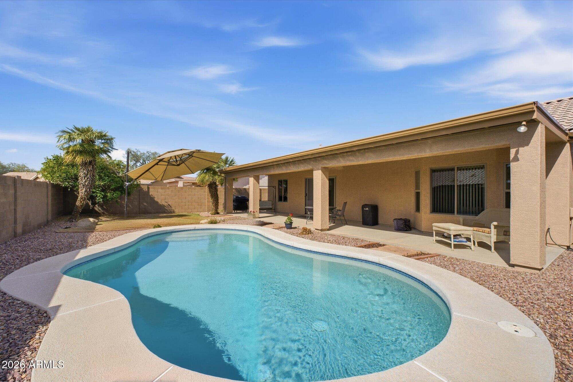 9327 West Mountain View Road Peoria, AZ 85345 - Photo 18 of 30 a view of a house with swimming pool