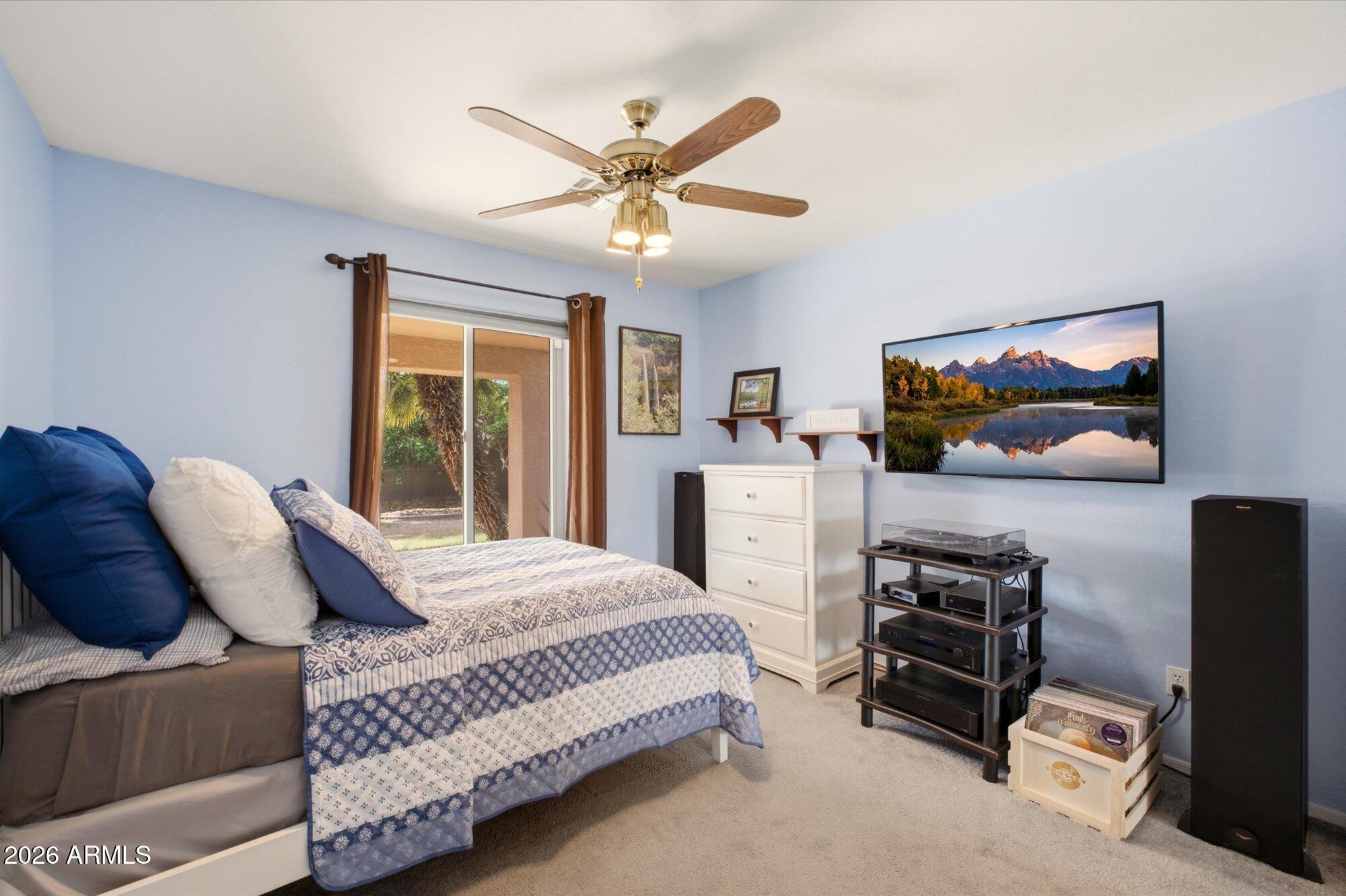 9327 West Mountain View Road Peoria, AZ 85345 - Photo 20 of 30 a bedroom with a bed and a flat screen tv
