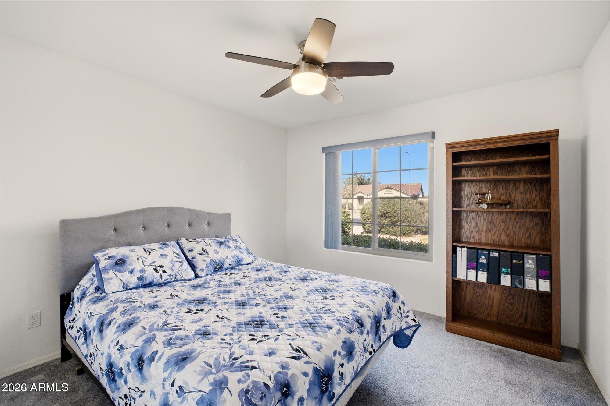 9327 West Mountain View Road Peoria, AZ 85345 - Photo 21 of 30 a bedroom with a large bed and a window