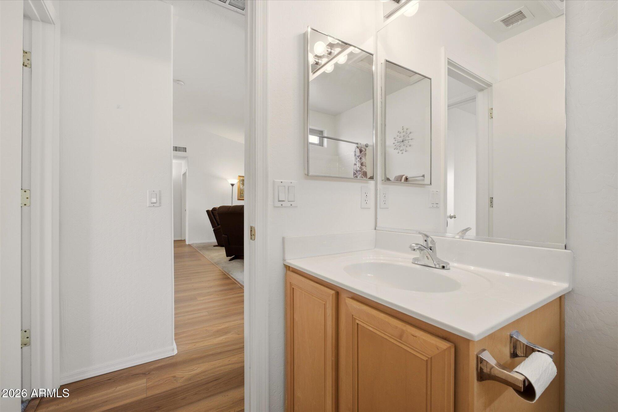 9327 West Mountain View Road Peoria, AZ 85345 - Photo 22 of 30 a bathroom with a sink and a mirror