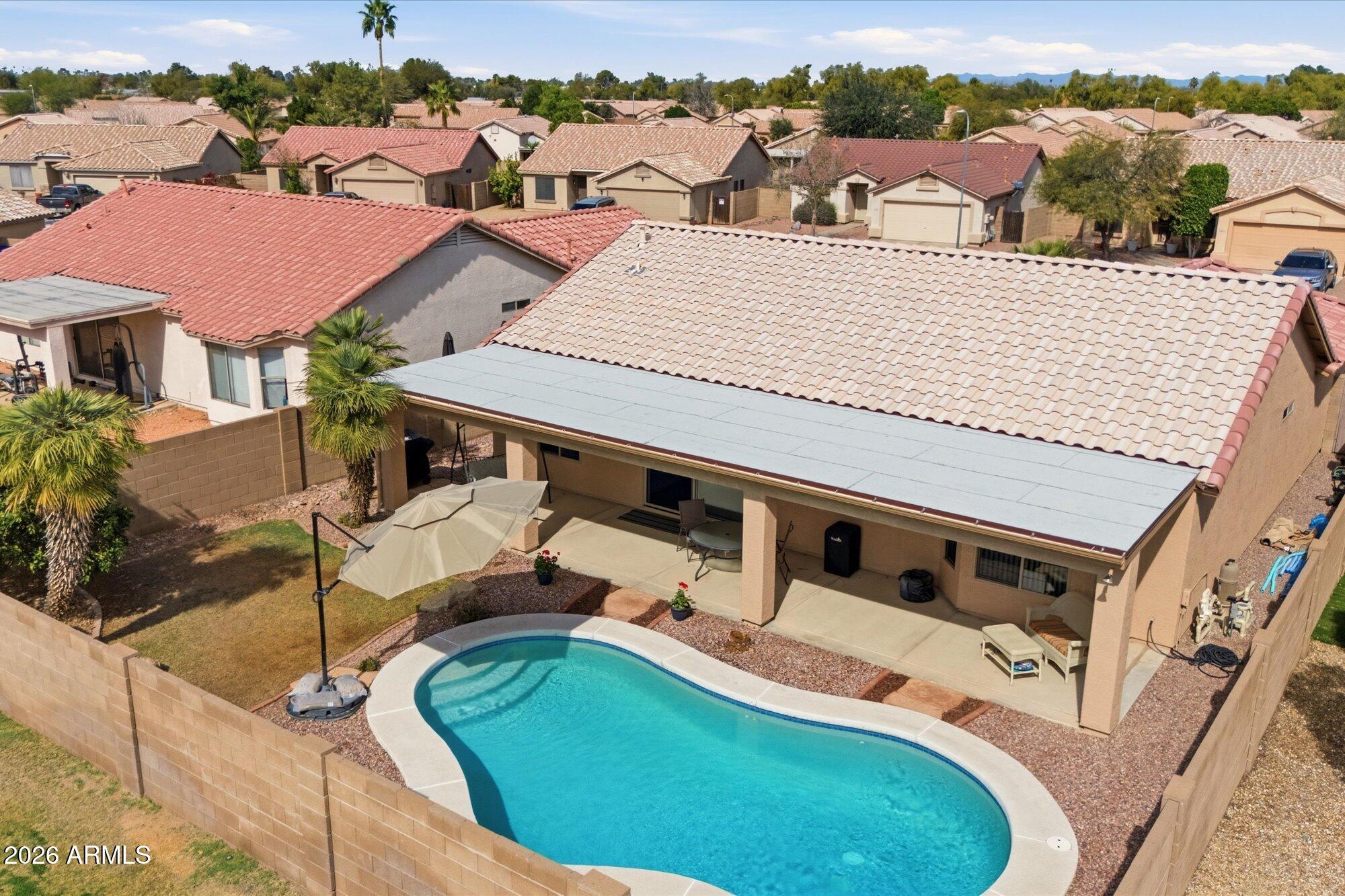 9327 West Mountain View Road Peoria, AZ 85345 - Photo 26 of 30 an aerial view of a house with a yard