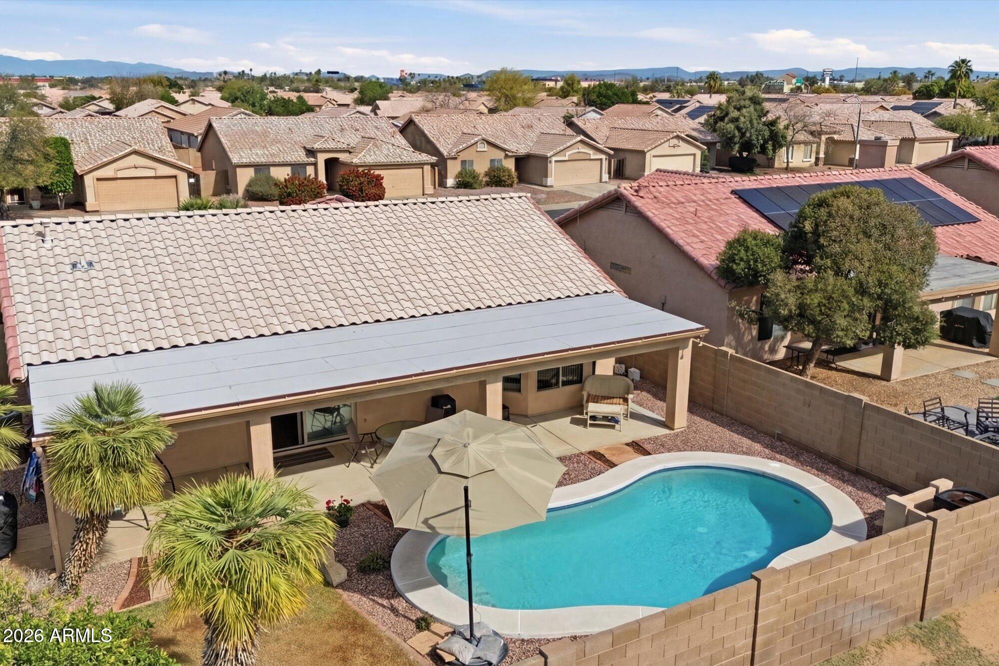 9327 West Mountain View Road Peoria, AZ 85345 - Photo 4 of 30 an aerial view of a house with a yard