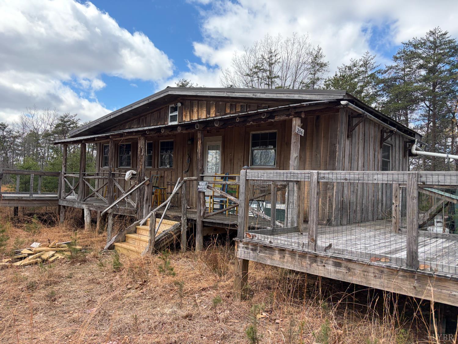 0 Christian Mill Creek Road Amherst, VA 24521 - Photo 21 of 31 a view of a house with wooden deck area and roof