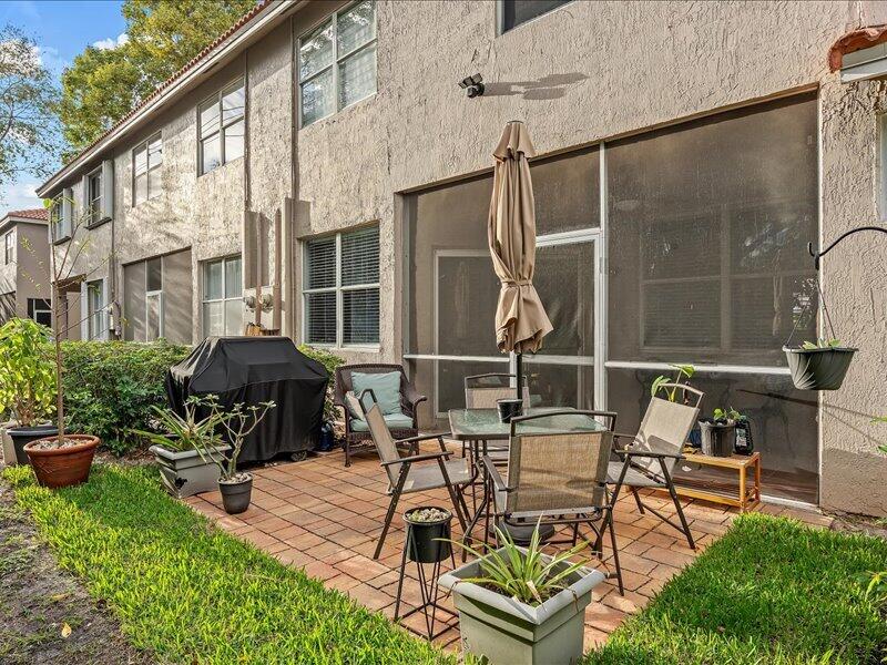20970 Via Alamanda Boca Raton, FL 33428 - Photo 18 of 51 a view of a patio with furniture